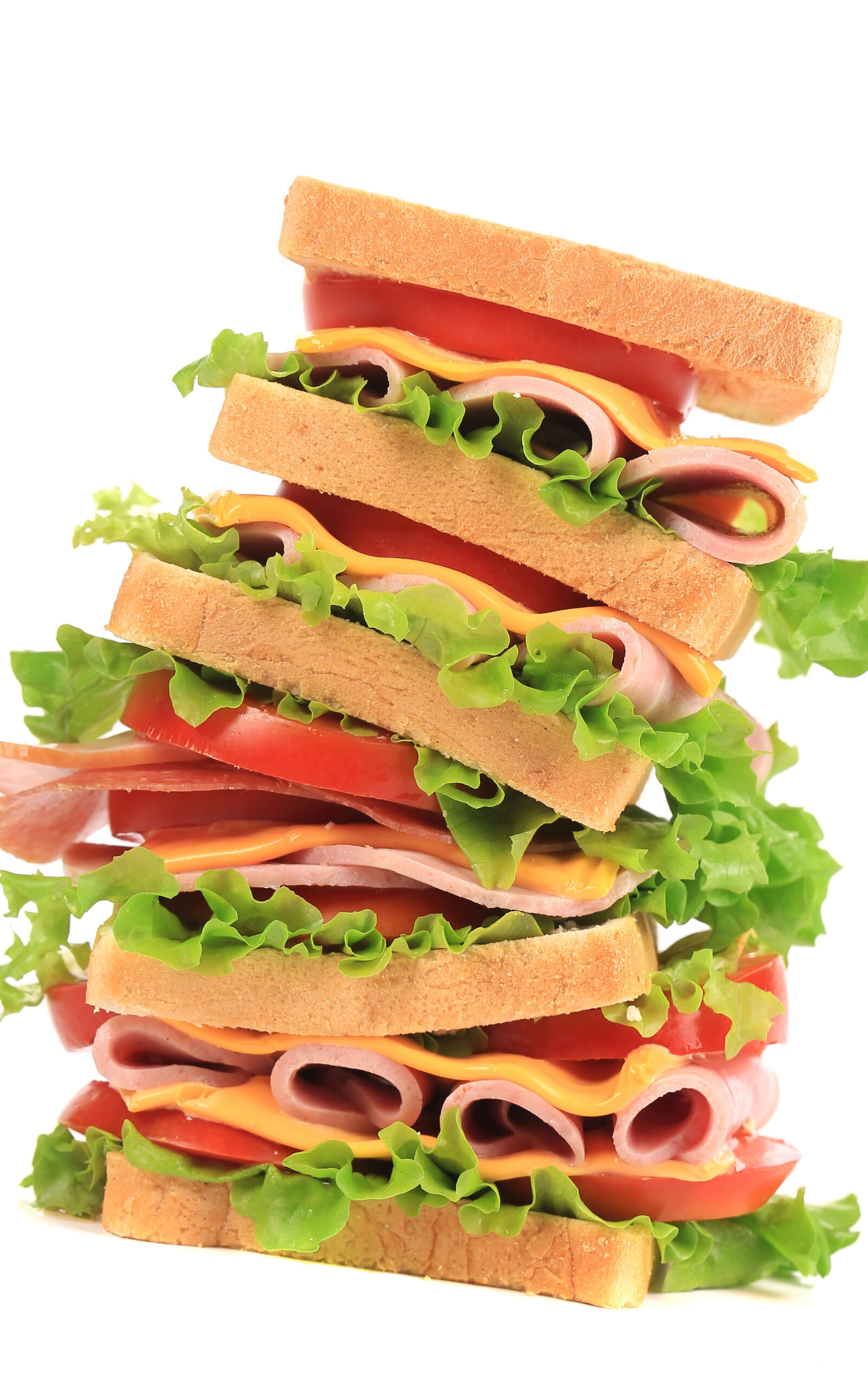 A very tall sandwich! Six slices of bread with tomato, cheese, meat, and lettuce between each pair.
